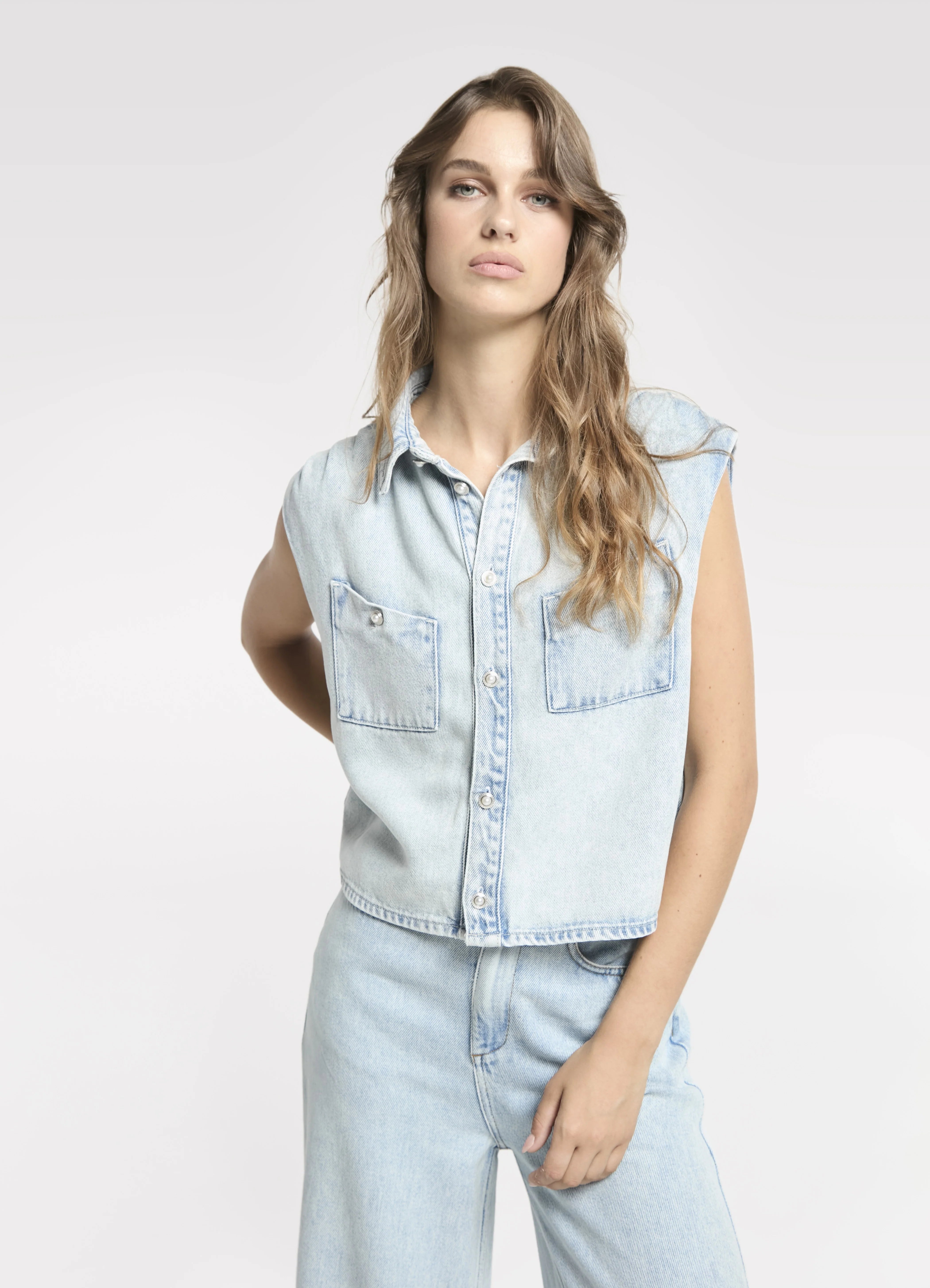 Homage Sleeveless Denim Blouse With Pleats